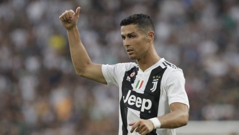Juventus' Cristiano Ronaldo, gestures to his teammates during the Serie A soccer match between Juventus and Lazio at the Allianz Stadium in Turin, Italy, Saturday, Aug. 25, 2018. (AP Photo/Luca Bruno)