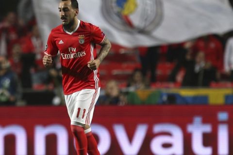 Benfica's Kostas Mitroglou walks after scoring the opening goal during the Champions League round of 16, first leg, soccer match between Benfica and Borussia Dortmund at the Luz stadium in Lisbon, Tuesday, Feb. 14, 2017. (AP Photo/Armando Franca)
