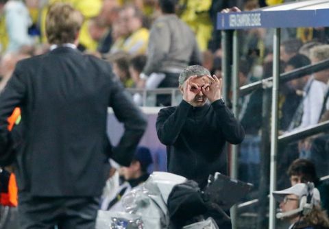 Real Madrid's coach Jose Mourinho from Portugal, right, gestures while Dortmund head coach Juergen Klopp, left, looks at him during the Champions League semifinal first leg soccer match between Borussia Dortmund and Real Madrid in Dortmund, Germany, Wednesday, April 24, 2013. (AP Photo/Frank Augstein)