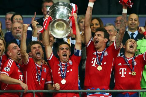 LONDON, ENGLAND - MAY 25:  Captain Philipp Lahm of Bayern Muenchen lifts the trophy after winning the UEFA Champions League final match against Borussia Dortmund at Wembley Stadium on May 25, 2013 in London, United Kingdom.  (Photo by Alex Grimm/Getty Images)
