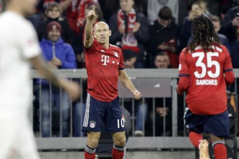 Bayern's Arjen Robben celebrates after scoring his side's opening goal during the German Bundesliga soccer match between FC Bayern Munich and FC Augsburg in Munich, Germany, Tuesday, Sept. 25, 2018. (AP Photo/Matthias Schrader)