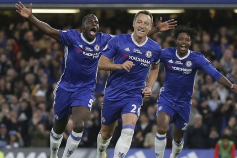 Chelsea's John Terry, centre, celebrates scoring a goal during the English Premier League soccer match between Chelsea and Watford at Stamford Bridge stadium in London, Monday, May 15, 2017. (AP Photo/Tim Ireland)