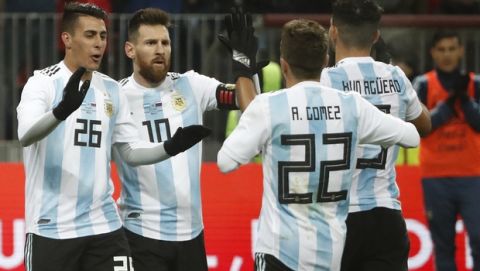 Argentina's Sergio Aguero (9) celebrates with team mates Alejandro Gomez (22), Cristian Pavon (26) and Lionel Messi (10) after scoring his side's opening goal during the international friendly soccer match between Russia and Argentina at Luzhniki World Cup 2018 stadium in Moscow, Russia, Saturday, Nov. 11, 2017. (AP Photo/Pavel Golovkin)