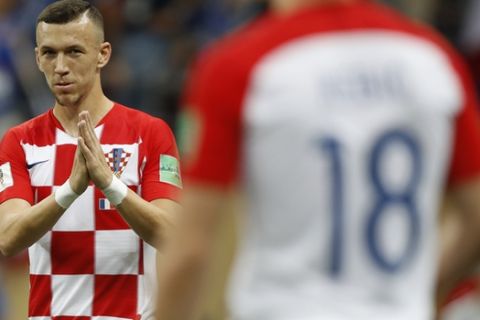 Croatia's Ivan Perisic gestures to teammate Croatia's Ante Rebic during the final match between France and Croatia at the 2018 soccer World Cup in the Luzhniki Stadium in Moscow, Russia, Sunday, July 15, 2018. (AP Photo/Francisco Seco)