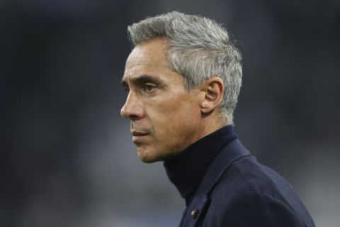 Bordeaux's head coach Paulo Sousa looks towards the pitch before the start of the French League One soccer match between Marseille and Bordeaux at the Velodrome stadium in Marseille, southern France, Sunday, Dec. 8, 2019. (AP Photo/Daniel Cole)