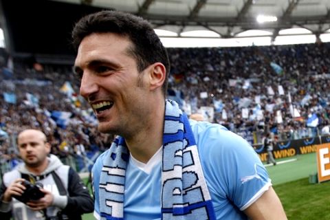 Lazio defender Lionel Scaloni, of Argentina, celebrates at the end of a Serie A soccer match between AS Roma and Lazio, at Rome's Olympic stadium, Sunday, March 4, 2012. Lazio beat 10-man Roma 2-1 in a heated Serie A derby match on Sunday to do the double over its rivals for the first time in 15 years and claim advantage in the race for third place. (AP Photo/Riccardo De Luca)