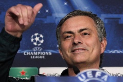 Real Madrid's coach Jose Mourinho from Portugal gestures during a news conference in Madrid, Spain, Tuesday, Feb. 12, 2013. Real Madrid will play Manchester United Wednesday in the first leg of a round of 16 Champions League soccer match in Madrid. (AP Photo/Andres Kudacki)