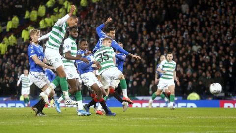 Celtic's Christopher Jullien scores his side's first goal of the game during the Scottish Cup soccer Final between Celtic and Rangers at Hampden Park, Glasgow, Scotland, Sunday, Dec. 8, 2019. (Jeff Holmes/PA via AP)