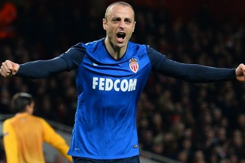 Monaco's Bulgarian forward Dimitar Berbatov celebrates scoring his team's second goal during the UEFA Champions League round of 16 first leg football match between Arsenal and Monaco at the Emirates Stadium in London on February 25, 2015.  AFP PHOTO / GLYN KIRK        (Photo credit should read GLYN KIRK/AFP/Getty Images)