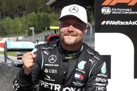 Race winner Mercedes driver Valtteri Bottas of Finland celebrates after winning the Austrian Formula One Grand Prix at the Red Bull Ring racetrack in Spielberg, Austria, Sunday, July 5, 2020. (Mark Thompson/Pool via AP)