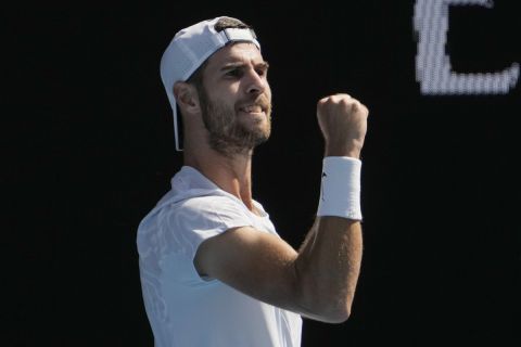 Karen Khachanov of Russia celebrates after defeating Yoshihito Nishioka of Japan during their fourth round match at the Australian Open tennis championship in Melbourne, Australia, Sunday, Jan. 22, 2023. (AP Photo/Ng Han Guan)