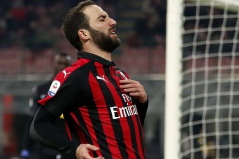 AC Milan's Gonzalo Higuain reacts after a missed chance to score during a Serie A soccer match between AC Milan and Spal, at the San Siro stadium, Saturday, Dec. 29, 2018. (AP Photo/Antonio Calanni)