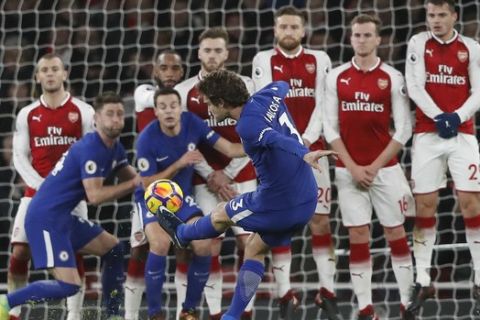 Chelsea's Marcos Alonso takes a free kick during the English Premier League soccer match between Arsenal and Chelsea at Emirates stadium in London, Wednesday, Jan. 3, 2018. (AP Photo/Frank Augstein)