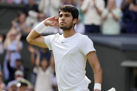 Spain's Carlos Alcaraz celebrates after winning the second set against Serbia's Novak Djokovic in the final of the men's singles on day fourteen of the Wimbledon tennis championships in London, Sunday, July 16, 2023. (AP Photo/Kirsty Wigglesworth)