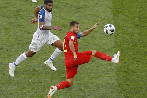 Belgium's Eden Hazard, right, lunges for the ball against Panama's Gabriel Gomez during the group G match between Belgium and Panama at the 2018 soccer World Cup in the Fisht Stadium in Sochi, Russia, Monday, June 18, 2018. (AP Photo/Victor R. Caivano)