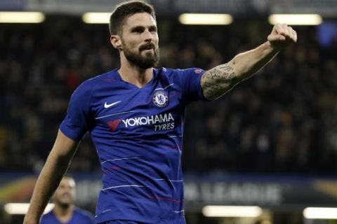 Chelsea's Oliver Giroud celebrates after scoring a goal during the Europa League Group L soccer match between Chelsea and PAOK at Stamford Bridge stadium, in London, Thursday, Nov. 29, 2018. (AP Photo/Matt Dunham)