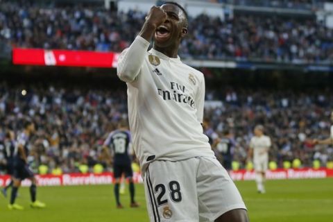 Real Madrid's Vinicius Junior celebrates after scoring his side's 1st goal during a Spanish La Liga soccer match between Real Madrid and Valladolid at the Santiago Bernabeu stadium in Madrid, Spain, Saturday, Nov. 3, 2018. (AP Photo/Paul White)