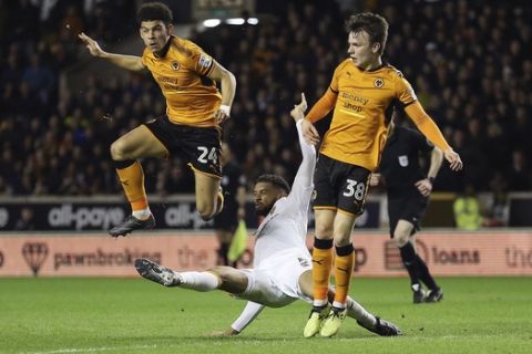 Wolverhampton Wanderers' Morgan Gibbs-White heads during the Sky Bet Championship match at Molineux, Wolverhampton, Tuesday, April 3, 2018. (Nigel French/PA via AP)