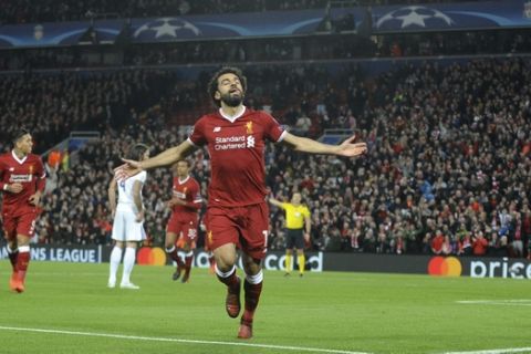 Liverpool's Mohamed Salah celebrates after scoring his side's opening goal during the Champions League Group E soccer match between Liverpool and Maribor at Anfield, Liverpool, England, Wednesday Nov. 1, 2017. (AP Photo/Rui Vieira)