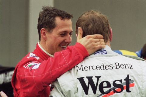 29 Apr 2001:  Ferrari driver Michael Schumacher consoles McLaren Mercedes driver Mika Hakkinen after the Formula One Spanish Grand Prix at the Circuit de Catalunya in Barcelona, Spain. Hakkinen broke down on the final lap to hand victory to Schumacher. \Mandatory Credit: Pascal Rondeau /Allsport
