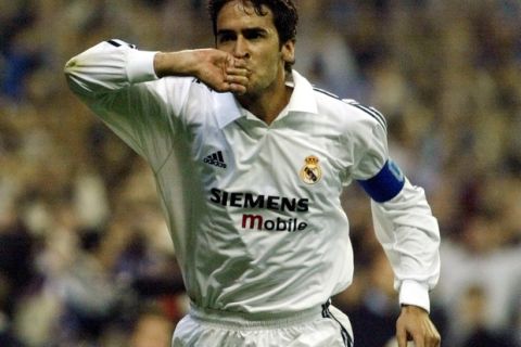 Real Madrid's Raul Gonzalez kisses his ring after scoring against AC Milan in their Champions League Group C soccer match played Wednesday, March 12, 2003 in Madrid, Spain. (AP Photo/Santiago Lyon)