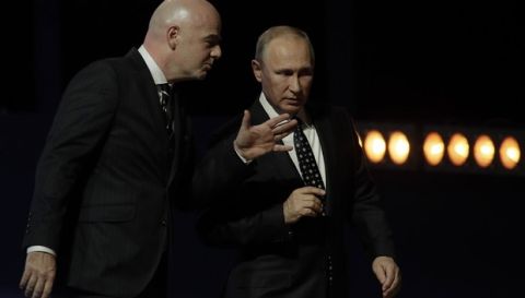 Russian President Vladimir Putin, right, and FIFA president Gianni Infantino speak during the 2018 soccer World Cup draw in the Kremlin in Moscow, Friday, Dec. 1, 2017. (AP Photo/Dmitri Lovetsky)