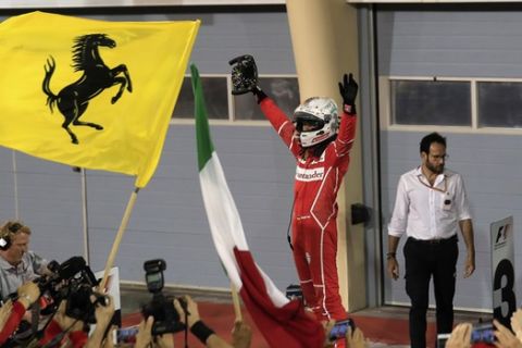 Ferrari driver Sebastian Vettel of Germany celebrates after winning the Bahrain Formula One Grand Prix, at the Formula One Bahrain International Circuit in Sakhir, Bahrain, Sunday, April 16, 2017. (AP Photo/Hassan Ammar)