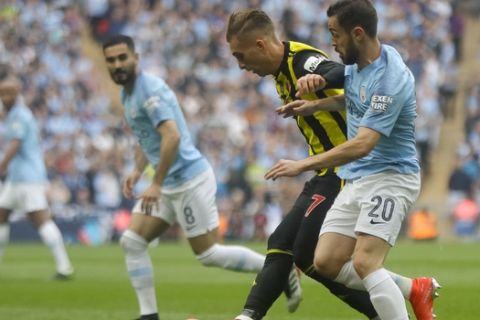Manchester City's Bernardo Silva, right, challenges for the ball with Watford's Gerard Deulofeu during the English FA Cup Final soccer match between Manchester City and Watford at Wembley stadium in London, Saturday, May 18, 2019. (AP Photo/Kirsty Wigglesworth)