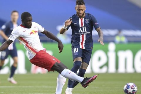 PSG's Neymar, right, challenges for the ball with Leipzig's Dayot Upamecano during the Champions League semifinal soccer match between RB Leipzig and Paris Saint-Germain at the Luz stadium in Lisbon, Portugal, Tuesday, Aug. 18, 2020. (David Ramos/Pool Photo via AP)