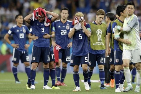 Japan's players react as they walk on the pitch after losing the round of 16 match between Belgium and Japan at the 2018 soccer World Cup in the Rostov Arena, in Rostov-on-Don, Russia, Monday, July 2, 2018. (AP Photo/Petr David Josek)