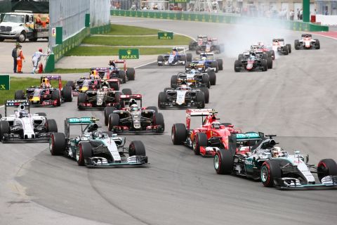 MONTREAL, QC - JUNE 07:  Lewis Hamilton of Great Britain and Mercedes GP leads into the first corner during the Canadian Formula One Grand Prix at Circuit Gilles Villeneuve on June 7, 2015 in Montreal, Canada.  (Photo by Mark Thompson/Getty Images)