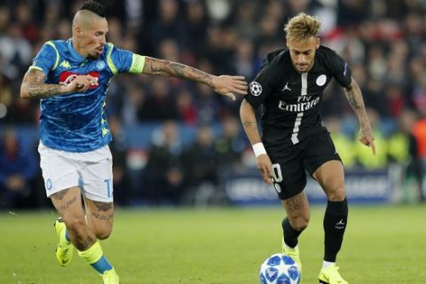 PSG's Neymar, right, challenges for the ball with Napoli's Marek Hamsik during the Champions League, group C, soccer match between Paris Saint Germain and Napoli at the Parc des Princes stadium in Paris, Wednesday, Oct. 24, 2018. (AP Photo/Francois Mori)
