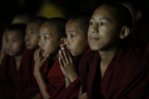 Young Tibetan Buddhist monks watch on television the final match of the World Cup Soccer 2018 between France and Croatia  at a monastery near Boudhanath stupa in Kathmandu, Nepal, Sunday, July 15, 2018. (AP Photo/Niranjan Shrestha)