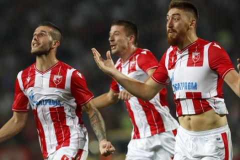 Red Star's Milan Pavkov, right, celebrates after scoring his side's opening goal during the Champions League third qualifying round, first leg soccer match between Red Star and FC Copenhagen on the stadium Rajko Mitic in Belgrade, Serbia, Tuesday, Aug. 6, 2019. (AP Photo/Darko Vojinovic)