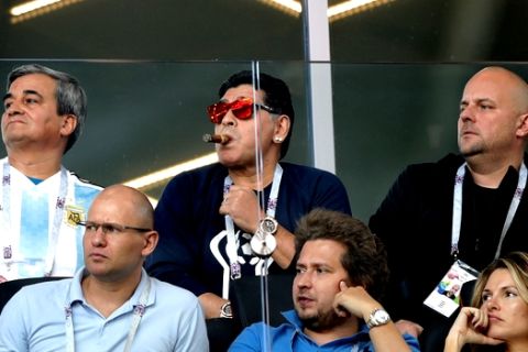 Former soccer star Diego Maradona, center, watches the group D match between Argentina and Iceland at the 2018 soccer World Cup in the Spartak Stadium in Moscow, Russia, Saturday, June 16, 2018. (AP Photo/Ricardo Mazalan)