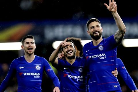 Chelsea's Pedro Rodriguez, center, celebrates with his teammates after scoring the opening goal during the Europa League round of 16, first leg soccer match between Chelsea and Dynamo Kyiv at Stamford Bridge stadium in London, Thursday, March 7, 2019. (AP Photo/Kirsty Wigglesworth)