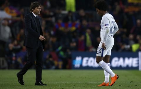 Chelsea's Willian walks towards Chelsea head coach Antonio Conte, left, at the end of the Champions League round of sixteen second leg soccer match between FC Barcelona and Chelsea at the Camp Nou stadium in Barcelona, Spain, Wednesday, March 14, 2018. (AP Photo/Manu Fernandez)
