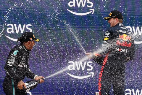 Second placed Mercedes driver Lewis Hamilton of Britain, left, and winner Red Bull driver Max Verstappen of the Netherlands celebrate after the Spanish Formula One Grand Prix at the Barcelona Catalunya racetrack in Montmelo, Spain, Sunday, June 4, 2023. (AP Photo/Joan Monfort)
