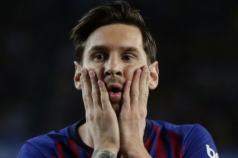 FC Barcelona's Lionel Messi reacts after missing an opportunity during the Spanish La Liga soccer match between FC Barcelona and Girona at the Camp Nou stadium in Barcelona, Spain, Sunday, Sept. 23, 2018. (AP Photo/Manu Fernandez)