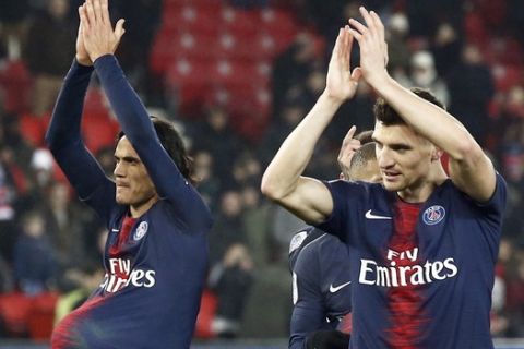 PSG's Edinson Cavani, Thomas Meunier and Thilo Kehrer, from left to right, celebrate at the end of the League One soccer match between Paris Saint Germain and Guingamp at the Parc des Princes stadium in Paris, Saturday, Jan. 19, 2019. PSG won 9-0. (AP Photo/Michel Euler)