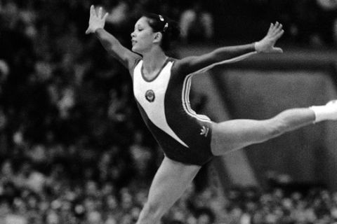 Soviet gymnast Nelli Kim gives a sparkling leap during her performance in floor exercise of womens gymnastics individual apparatus finals in Moscow Olympics Friday, July 26, 1980. Judges awarded the Soviet crowd pleaser with a score of 9.95 and the gold medal, which she shared with Romanian Nadia Comaneci. (AP Photo)