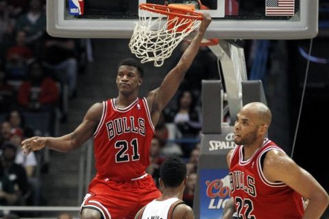 Milwaukee Bucks Jimmy Butler (21) dunks the ball on a pass during the second half of the the NBA game between the Milwaukee Bucks and Chicago Bulls at the BMO Harris Bradley Center, Wednesday, January 30, 2013. Milwaukee Journal Sentinel photo by Rick Wood/RWOOD@jOURNALSENTINEL.COM