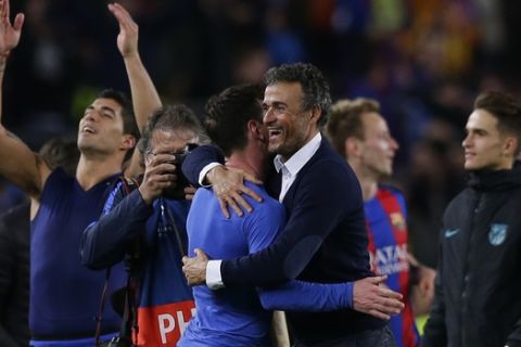 Barcelona's head coach Luis Enrique celebrates with Lionel Messi at the end of the Champions League round of 16, second leg soccer match between FC Barcelona and Paris Saint Germain at the Camp Nou stadium in Barcelona, Spain, Wednesday March 8, 2017. Barcelona won the match 6-1 (6-5 on aggregate). (AP Photo/Manu Fernandez)