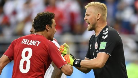Denmark goalkeeper Kasper Schmeichel, right, reacts after save a penalty kick during the group C match between Peru and Denmark at the 2018 soccer World Cup in the Mordovia Arena in Saransk, Russia, Saturday, June 16, 2018. (AP Photo/Martin Meissner)