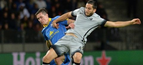 BATE Borisov's Belarusian forward Nikolai Signevich (L) fights for the ball with Roma's Greek defender Konstantinos Manolas during the UEFA Champions League group E football match between FC BATE Borisov and AS Roma at the Borisov-Arena in Borisov outside Minsk on September 29, 2015. AFP PHOTO / MAXIM MALINOVSKY        (Photo credit should read MAXIM MALINOVSKY/AFP/Getty Images)