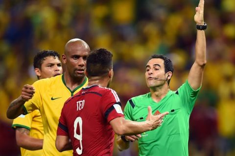 FORTALEZA, BRAZIL - JULY 04:  Teofilo Gutierrez of Colombia protests to referee Carlos Velasco Carballo during the 2014 FIFA World Cup Brazil Quarter Final match between Brazil and Colombia at Castelao on July 4, 2014 in Fortaleza, Brazil.  (Photo by Jamie McDonald/Getty Images)
