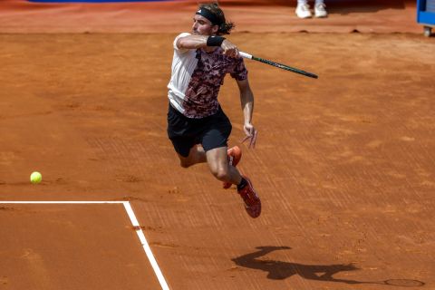 Stefanos Tsitsipas, of Greece, returns the ball against Lorenzo Musetti, of Italy, during a semi final open tennis tournament, in Barcelona, Spain, Saturday, April 22, 2023. (AP Photo/Joan Monfort)