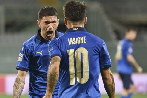 Italy's Stefano Sensi, left, is cheered by teammate Lorenzo Insigne after scoring during the UEFA Nations League soccer match between Italy and Bosnia Herzegovina, at the Artemio Franchi Stadium in Florence, Italy, Friday, Sept. 4, 2020. (Massimo Paolone/LaPresse via AP)