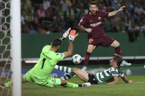 Barcelona's Lionel Messi, top, takes a shot at goal as Sporting's Fabio Coentrao, bottom, and Sporting goalkeeper Rui Patricio try to stop him during a Champions League, Group D soccer match between Sporting CP and FC Barcelona at the Alvalade stadium in Lisbon, Wednesday Sept. 27, 2017. (AP Photo/Armando Franca)