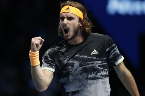 Stefanos Tsitsipas of Greece celebrates after winning a point against Spain's Rafael Nadal during their ATP World Tours Finals singles tennis match at the O2 Arena in London, Friday, Nov. 15, 2019. (AP Photo/Alastair Grant)